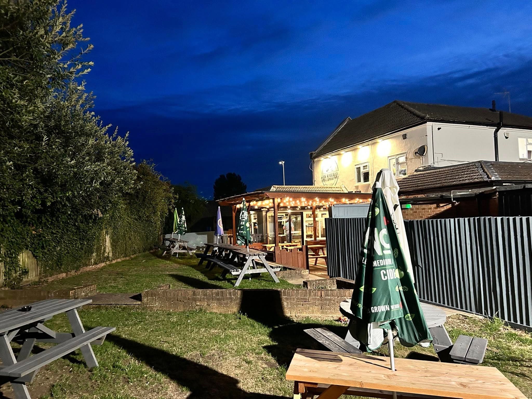 The Railway's beer garden lit up at night